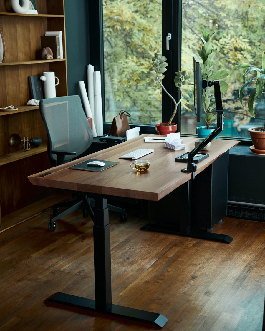 A desk by a window in morning light